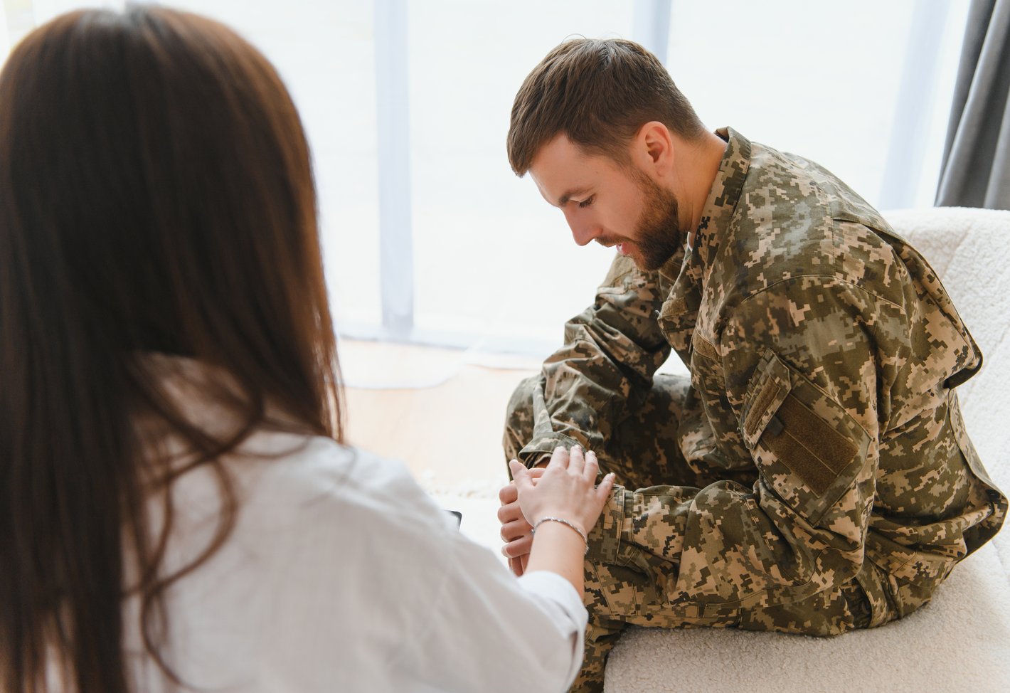 Women assuring solider